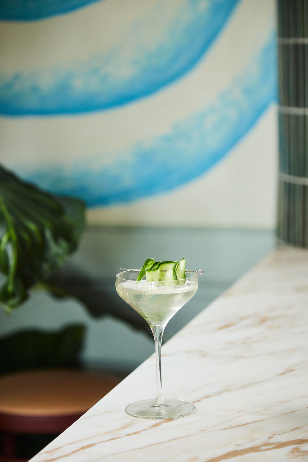 A cucumber cocktail on the marble bar at Elektra