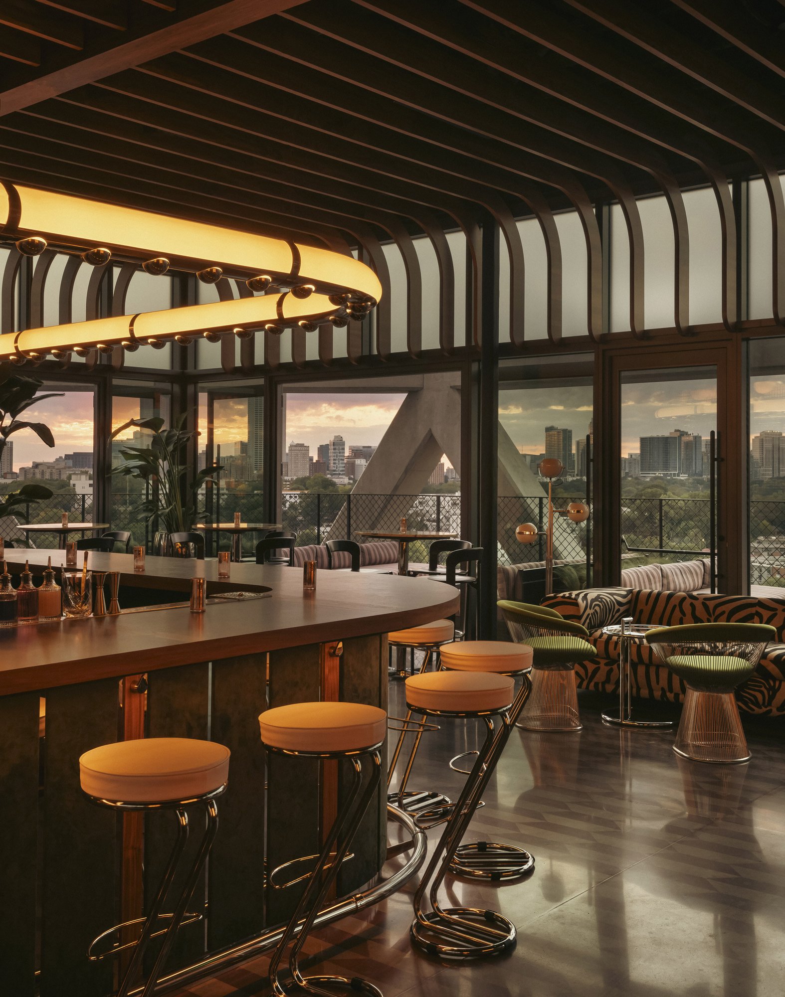 The Moonlight rooftop bar at dusk, its stools facing the Atlanta skyline