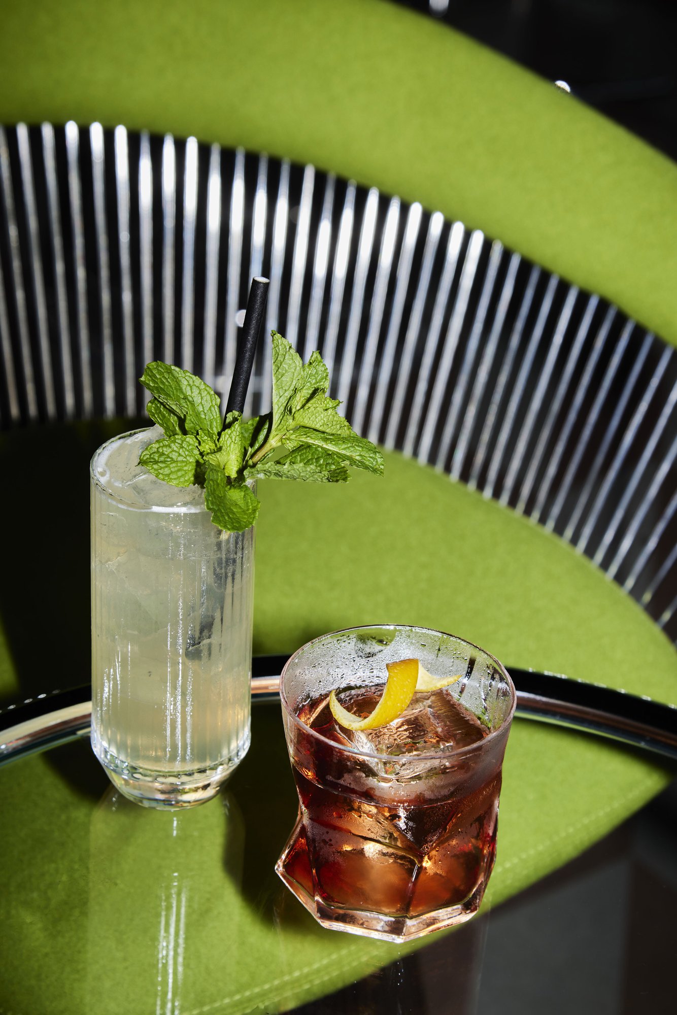 Two cocktails on a green table at Moonlight